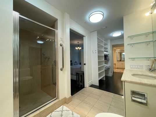 Bathroom, Chandelier, Dual Sink Vanities, Glass Shower, Interior, Walk-in Closets, Wood Texture Flooring