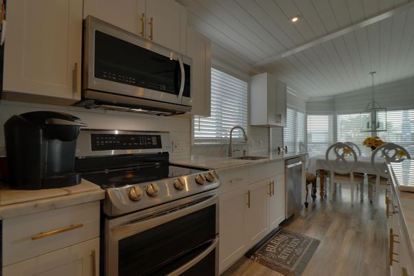 Dining room, Interior, Kitchen, Pendant Lights, Recessed Lighting, Stainless Steel Appliances, Wood Texture Flooring