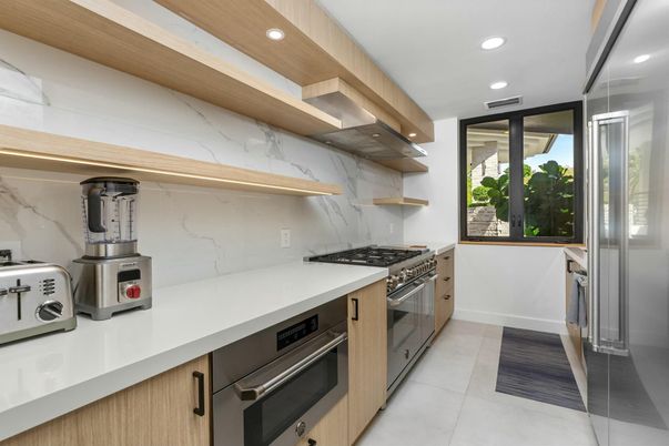 Interior, Kitchen, Marble Walls, Recessed Lighting, Stainless Steel Appliances