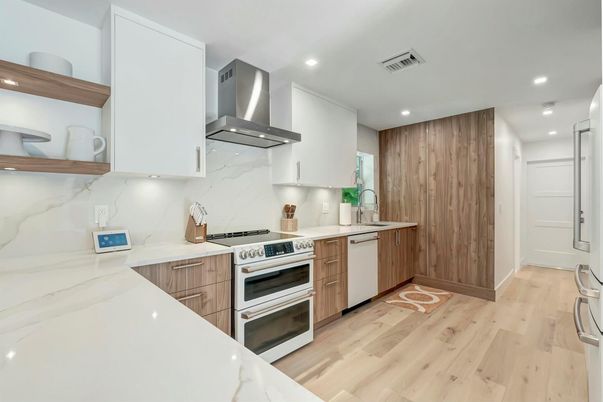 Interior, Kitchen, Marble Walls, Recessed Lighting, Stainless Steel Appliances, Wood Texture Flooring