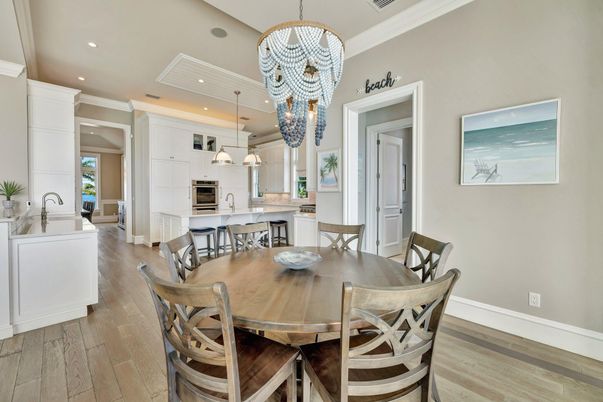 Chandelier, Dining room, Interior, Kitchen, Pendant Lights, Recessed Lighting, Stainless Steel Appliances, Wood Texture Flooring