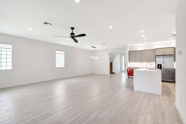 Empty room, Interior, Kitchen, Pendant Lights, Recessed Lighting, Stainless Steel Appliances, Wood Texture Flooring