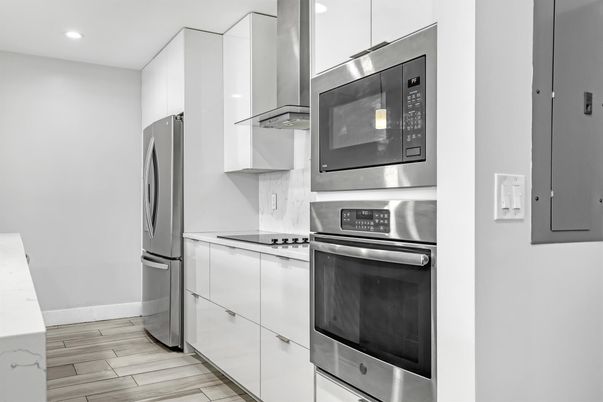 Interior, Kitchen, Recessed Lighting, Stainless Steel Appliances, Wood Texture Flooring