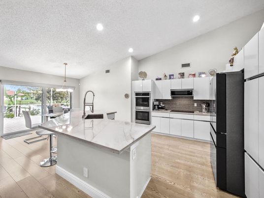 Dining room, Interior, Kitchen, Pendant Lights, Recessed Lighting, Stainless Steel Appliances, Wood Texture Flooring