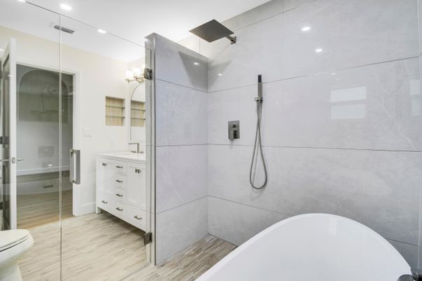 Bathroom, Dual Sink Vanities, Free Standing Baths, Glass Shower, Interior, Recessed Lighting, Wood Texture Flooring