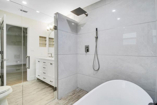 Bathroom, Dual Sink Vanities, Free Standing Baths, Glass Shower, Interior, Recessed Lighting, Wood Texture Flooring