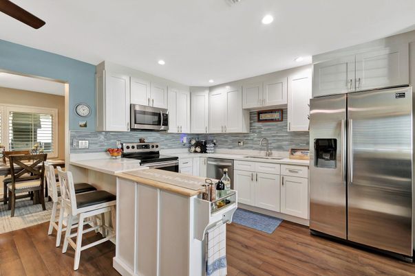 Dining room, Interior, Kitchen, Recessed Lighting, Stainless Steel Appliances, Wood Texture Flooring