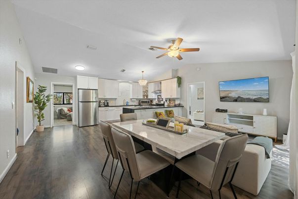 Chandelier, Dining room, Interior, Kitchen, Stainless Steel Appliances, Wood Texture Flooring