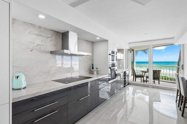 Interior, Kitchen, Marble Walls, Recessed Lighting, Stainless Steel Appliances, Water