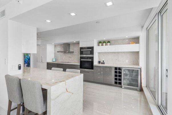 Interior, Kitchen, Marble Walls, Recessed Lighting, Stainless Steel Appliances