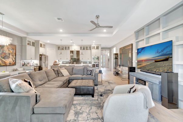 Chandelier, Interior, Kitchen, Living room, Pendant Lights, Recessed Lighting, Stainless Steel Appliances, Wood Texture Flooring