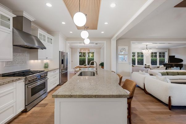 Chandelier, Dining room, Interior, Kitchen, Living room, Pendant Lights, Recessed Lighting, Stainless Steel Appliances, Wood Texture Flooring