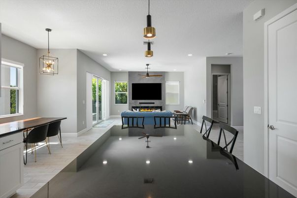Billiard Table, Dining room, Fireplace, Game Room, Interior, Living room, Pendant Lights, Recessed Lighting, Wood Texture Flooring