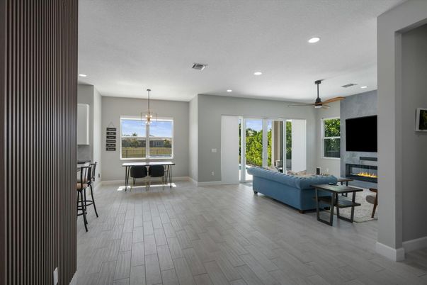 Dining room, Fireplace, Interior, Living room, Pendant Lights, Recessed Lighting, Wood Texture Flooring