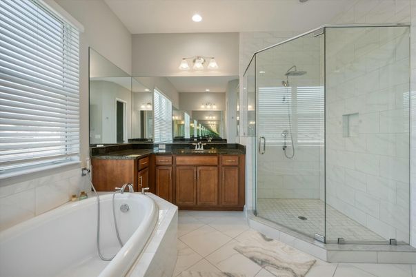 Bathroom, Dual Sink Vanities, Glass Shower, Interior, Marble, Marble Walls, Recessed Lighting