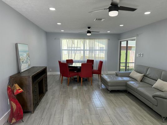 Dining room, Fireplace, Interior, Living room, Recessed Lighting, Wood Texture Flooring