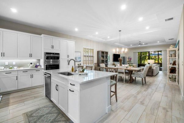 Chandelier, Dining room, Interior, Kitchen, Living room, Pendant Lights, Recessed Lighting, Stainless Steel Appliances, Wood Texture Flooring