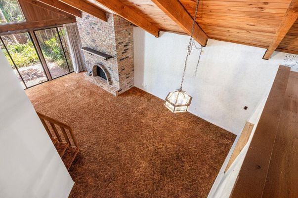 Empty room, Fireplace, Interior, Pendant Lights, Stone Walls, Wooden Beams, Wooden Ceilings