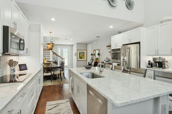 Dining room, Interior, Kitchen, Pendant Lights, Recessed Lighting, Stainless Steel Appliances, Wood Texture Flooring