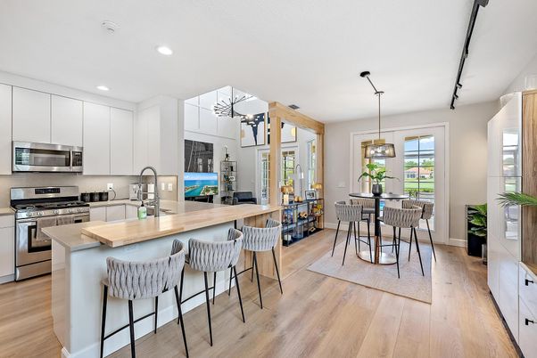 Chandelier, Dining room, Interior, Kitchen, Pendant Lights, Recessed Lighting, Stainless Steel Appliances, Wood Texture Flooring