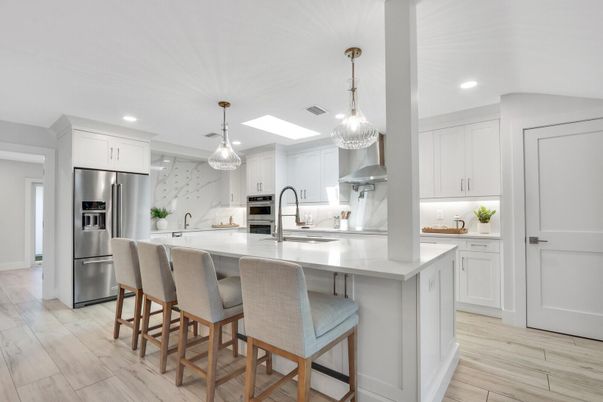 Interior, Kitchen, Marble Walls, Pendant Lights, Recessed Lighting, Stainless Steel Appliances, Wood Texture Flooring