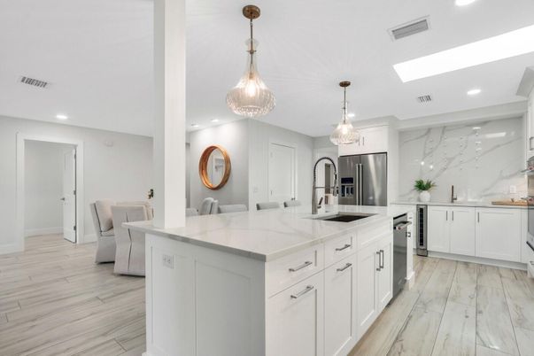Interior, Kitchen, Marble Walls, Pendant Lights, Recessed Lighting, Stainless Steel Appliances, Wood Texture Flooring