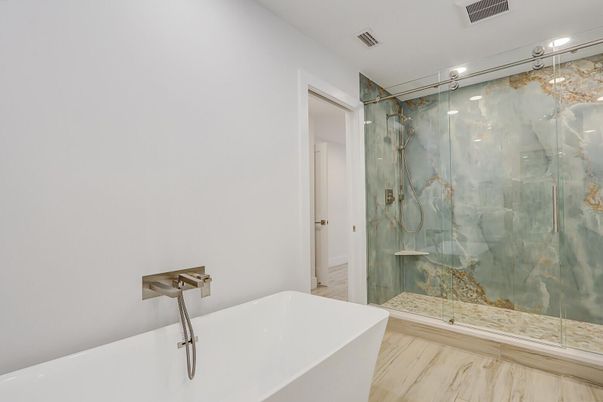 Bathroom, Free Standing Baths, Glass Shower, Interior, Marble Walls, Recessed Lighting, Wood Texture Flooring