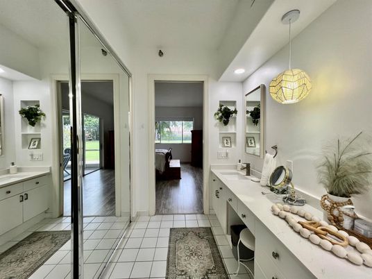 Bathroom, Dual Sink Vanities, Free Standing Baths, Interior, Pendant Lights, Recessed Lighting, Wood Texture Flooring