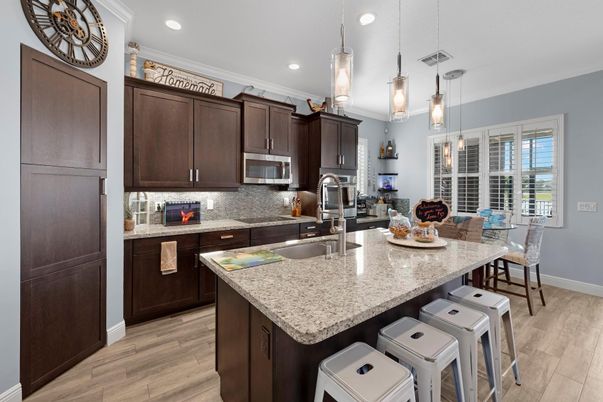 Dining room, Interior, Kitchen, Pendant Lights, Recessed Lighting, Stainless Steel Appliances, Wood Texture Flooring