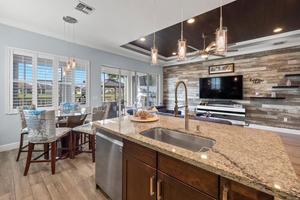 Dining room, Interior, Kitchen, Pendant Lights, Recessed Lighting, Stainless Steel Appliances, Stone Walls, Wood Texture Flooring, Wooden Walls