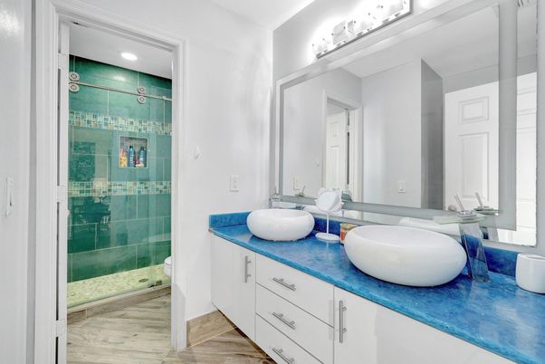 Bathroom, Dual Sink Vanities, Glass Shower, Interior, Recessed Lighting, Wood Texture Flooring