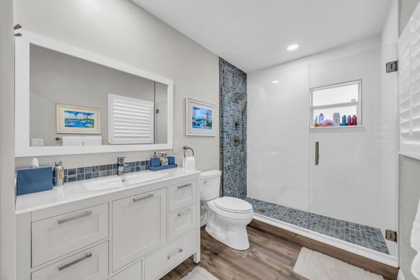 Bathroom, Dual Sink Vanities, Glass Shower, Interior, Recessed Lighting, Wood Texture Flooring