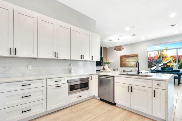 Interior, Kitchen, Marble Walls, Pendant Lights, Recessed Lighting, Stainless Steel Appliances, Wood Texture Flooring