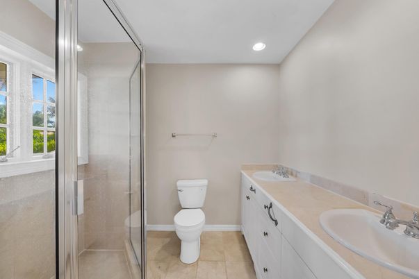 Bathroom, Dual Sink Vanities, Glass Shower, Interior, Recessed Lighting, Tile Countertops