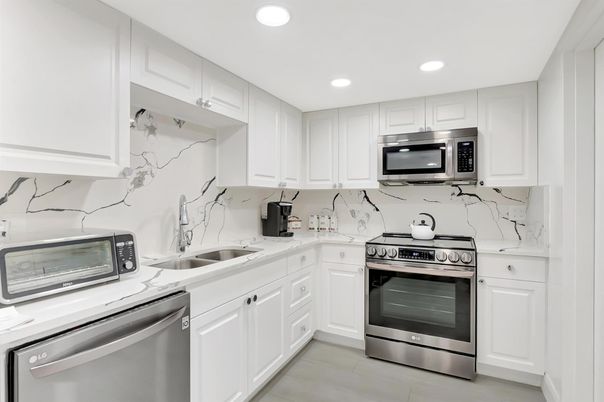 Interior, Kitchen, Marble Walls, Recessed Lighting, Stainless Steel Appliances