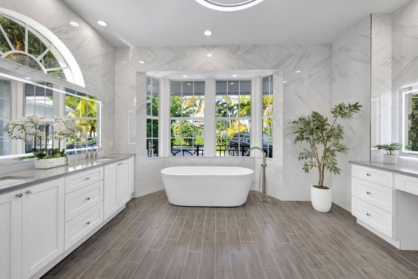 Bathroom, Dual Sink Vanities, Free Standing Baths, Interior, Marble Walls, Recessed Lighting, Wood Texture Flooring