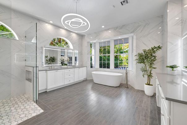 Bathroom, Dual Sink Vanities, Free Standing Baths, Interior, Marble Walls, Pendant Lights, Recessed Lighting, Wood Texture Flooring