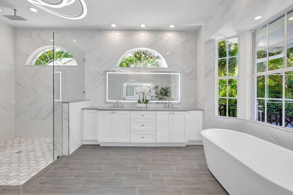 Bathroom, Dual Sink Vanities, Free Standing Baths, Glass Shower, Interior, Marble Walls, Recessed Lighting, Wood Texture Flooring