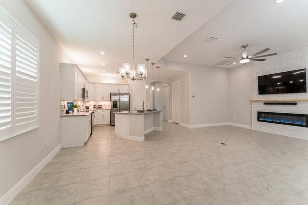 Fireplace, Interior, Kitchen, Pendant Lights, Recessed Lighting, Stainless Steel Appliances, Stone Walls