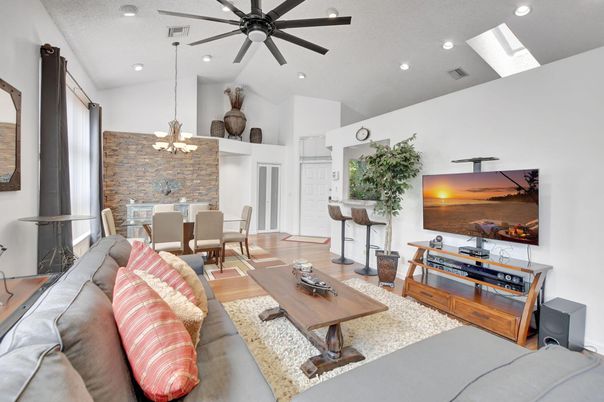 Chandelier, Dining room, Interior, Living room, Recessed Lighting, Stone Walls, Wood Texture Flooring