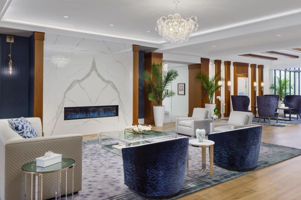 Chandelier, Fireplace, Interior, Living room, Marble Walls, Recessed Lighting, Wood Texture Flooring