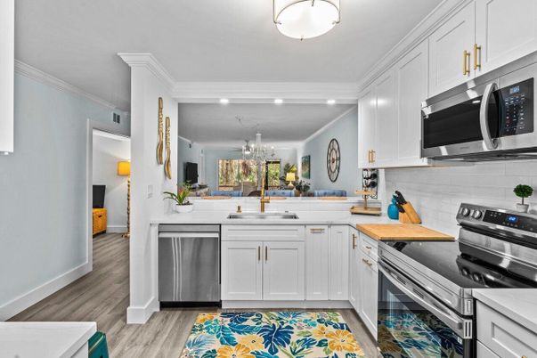 Chandelier, Dining room, Interior, Kitchen, Recessed Lighting, Stainless Steel Appliances, Wood Texture Flooring