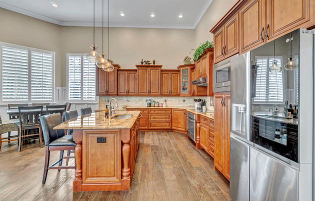 Dining room, Interior, Kitchen, Pendant Lights, Recessed Lighting, Stainless Steel Appliances, Wood Texture Flooring