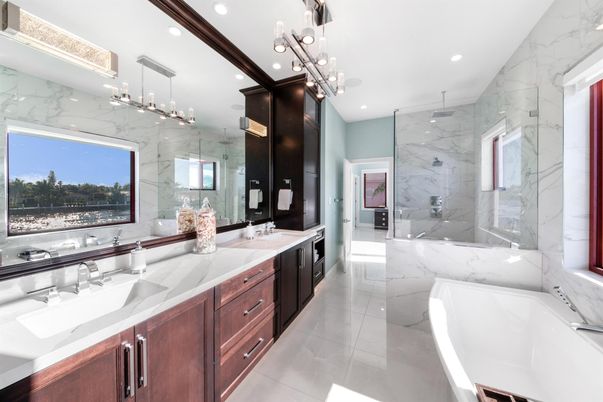 Bathroom, Dual Sink Vanities, Free Standing Baths, Glass Shower, Interior, Marble, Marble Walls, Pendant Lights, Recessed Lighting