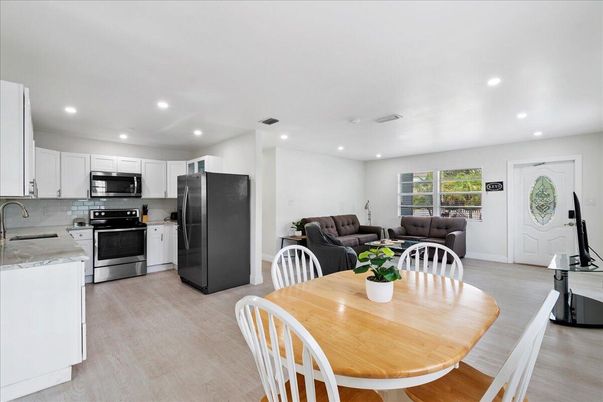 Dining room, Interior, Kitchen, Living room, Recessed Lighting, Stainless Steel Appliances, Wood Texture Flooring