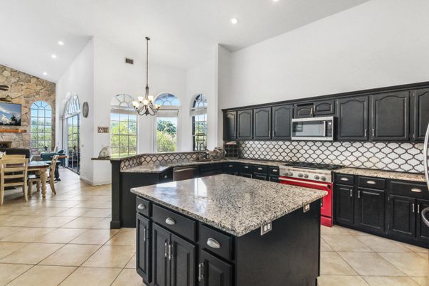 Chandelier, Dining room, Interior, Kitchen, Recessed Lighting, Stainless Steel Appliances, Stone Walls