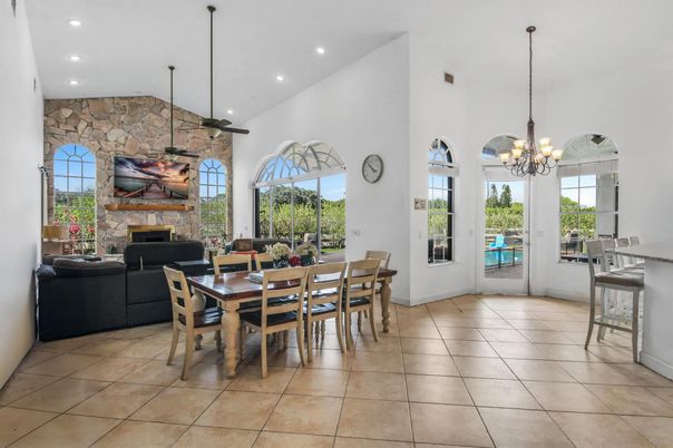Chandelier, Dining room, Fireplace, Interior, Living room, Recessed Lighting, Stone Walls