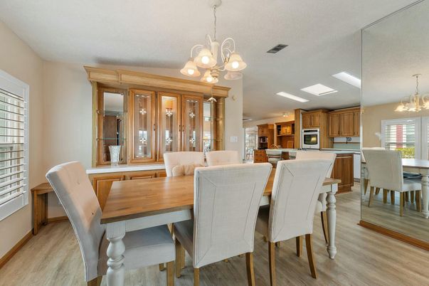 Chandelier, Dining room, Interior, Kitchen, Recessed Lighting, Stainless Steel Appliances, Wood Texture Flooring