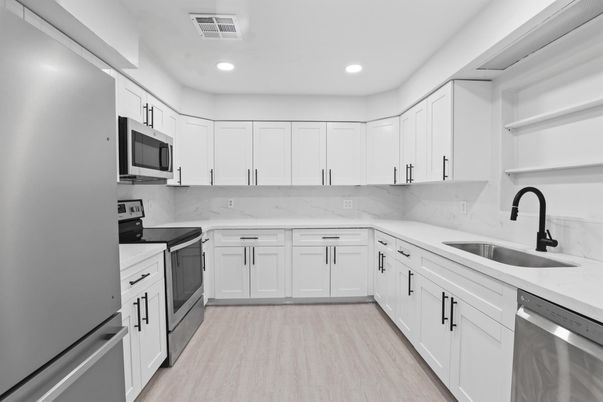 Interior, Kitchen, Marble Walls, Recessed Lighting, Stainless Steel Appliances, Wood Texture Flooring