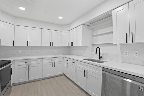 Interior, Kitchen, Marble Walls, Recessed Lighting, Stainless Steel Appliances, Wood Texture Flooring